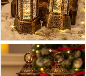 Detail view of a vintage bronze Christmas lantern with a swirling snow globe scene inside