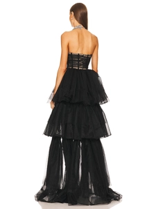 Detail of layered black tulle ruffles and back view of a strapless fishtail evening gown