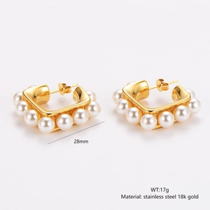 Detailed view of 18k gold plated stainless steel square earrings with pearl inlay and specs
