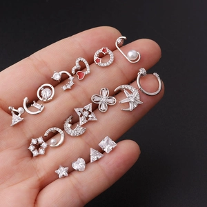 Polished stainless steel ear piercing set with cubic zirconia and star heart designs