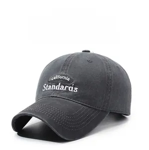 Detail of embroidered California lettering on washed grey cotton baseball cap