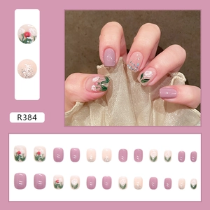 Short square purple tulip press-on nails with glitter accents and floral design