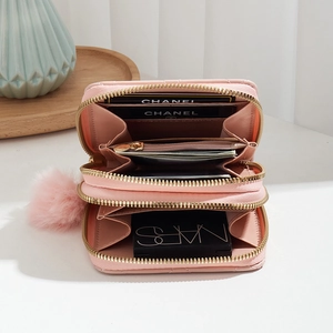 Pink quilted double-zipper short wallet with plush pompom charm and multi-card slots