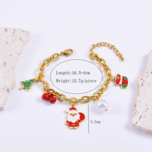 Detail shot of Christmas bracelet with Santa, tree, and bell charms on stone display
