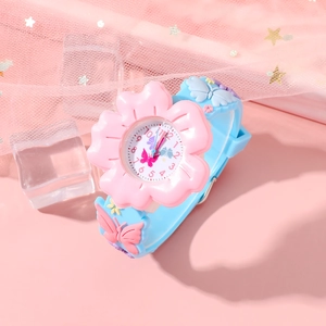 Detail of pink flower-shaped watch case and blue strap with butterfly ornaments