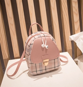 Detail of pink plaid PU leather mini backpack with golden heart-shaped metal lock