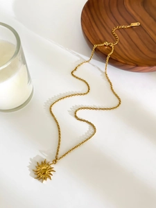 Detail of 18K gold plated sun pendant necklace with adjustable extension chain