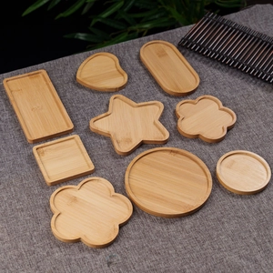Various geometric bamboo wood coasters including heart star and flower shapes set