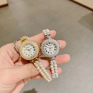 Elegant gold and silver pearl bracelet watches for women with rhinestone bezels