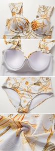 Detail of nautical print one-piece swimsuit featuring built-in breast pads and premium fabric