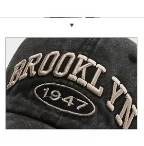 Close-up of 3D embroidered Brooklyn 1947 lettering on a washed cotton baseball cap