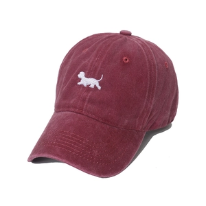 Retro washed burgundy baseball cap featuring a white dog embroidery with curved brim
