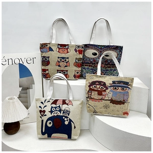 Detailed set of canvas tote bags featuring colorful cartoon owl and elephant embroidery