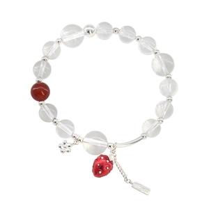 Minimalist beaded strawberry bracelet with clear glass beads and red enamel charm