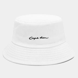 White cotton bucket hat with black Carpe Diem embroidery in a minimalist fashion style