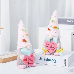 Handcrafted Mother's Day faceless gnomes with pink hats holding heart-shaped plush ornaments