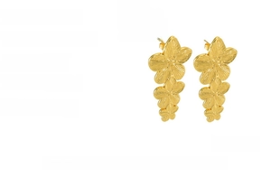 Detail of tiered gold flower earrings showing 18K plating and brushed metal texture