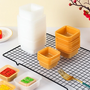 Thick food-grade PP square mooncake trays in gold and white colors for pastry packaging