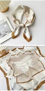 Detail of silk square scarf with brown gold stripes and FLOWER print on satin fabric