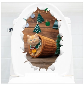 Detail of Christmas cat sticker with basket design on a white toilet lid cover