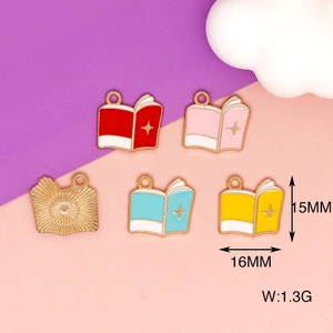 Detailed view of book-shaped alloy enamel charms with 15x16mm size and 1.3g weight specs