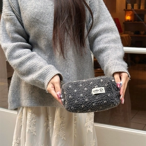 Winter plush pencil case with white polka dots and spacious zipper closure storage