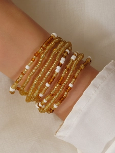 Close-up of bohemian handmade colorful beaded waist chain wrapped around the wrist