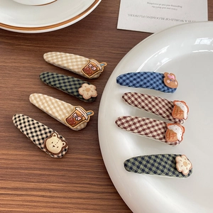 Set of 8 Korean style plaid fabric animal hair clips for kids on a white plate