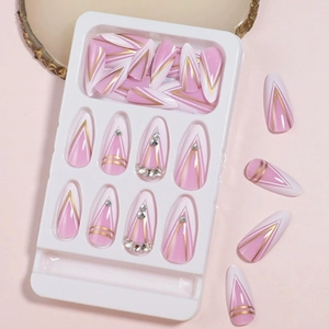 Pink press-on nails with French lines and rhinestones on a white display tray