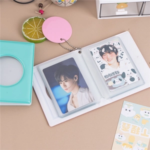 Detail view of heart cutout 3-inch photo album with green cover and white inner pages