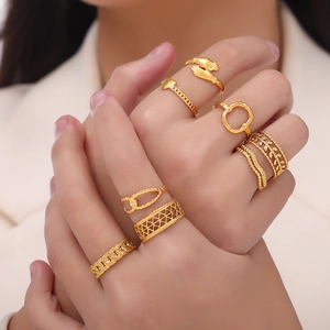 Chic multi-layered gold titanium steel rings with hollow textures for a minimalist look