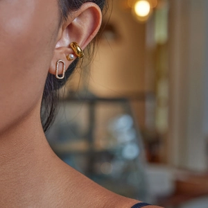 Minimalist gold hoop ear cuff with pearl stud and rectangular crystal earrings