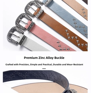 Detail of bohemian engraved zinc alloy buckle and star rivets on punk style wide belts