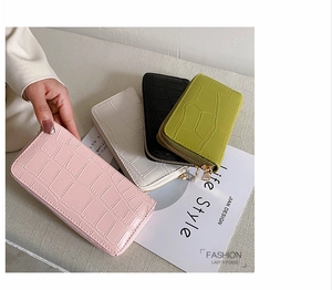 Close-up of embossed crocodile pattern on high-quality PU leather women's long wallets