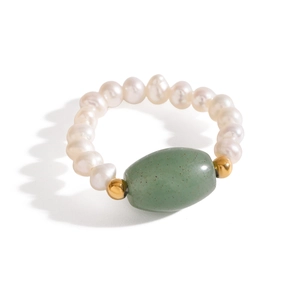Minimalist pearl beaded ring featuring an oval emerald green stone and golden accents