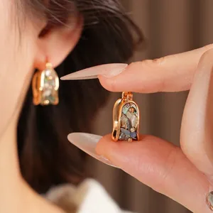 Vintage gold plated U-shaped earrings with mother of pearl and zircon details