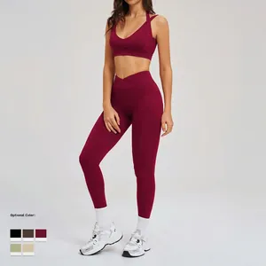 Completo yoga rosso scuro con reggiseno a V e leggings a vita incrociata con tasche laterali