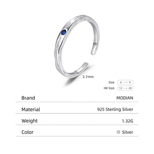 925 sterling silver open ring with unique foil texture and a blue round gemstone
