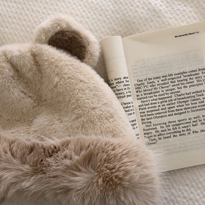 Detailed view of the thick plush bear ear hat in khaki fleece for winter outdoor warmth