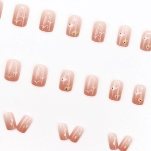 Pink gradient press-on nails with white bird and heart patterns in 24-piece set