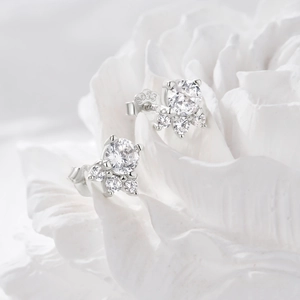 Macro shot of S925 sterling silver flower stud earrings with brilliant zircon stones