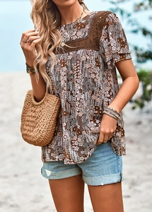Close-up of floral print top for women featuring delicate lace trim on the neckline