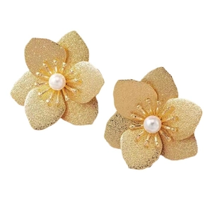 Vintage gold petal earrings with matte metal texture and central white pearls