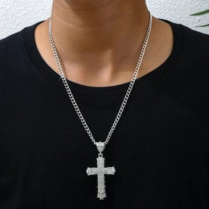 Hip hop silver cross pendant necklace with diamonds worn by model on black t-shirt