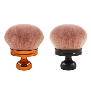 Dual mushroom head makeup brushes with fluffy pink bristles and metallic orange handles
