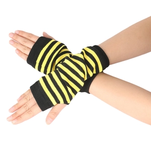 Detail of black and yellow striped knitted fingerless gloves with soft texture
