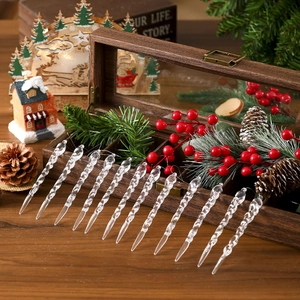 Set of 12 transparent icicle ornaments for Christmas tree decor on rustic wood background