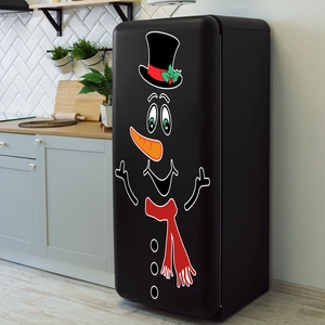 Close-up of a black refrigerator decorated with DIY cartoon snowman magnets in a kitchen