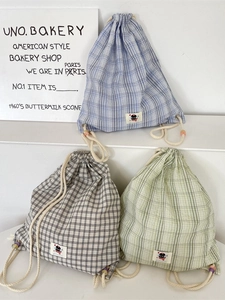 Stylish plaid canvas drawstring backpack in blue, black and green checkered patterns