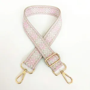 3.8cm wide canvas shoulder strap with pink geometric jacquard and gold metal hooks